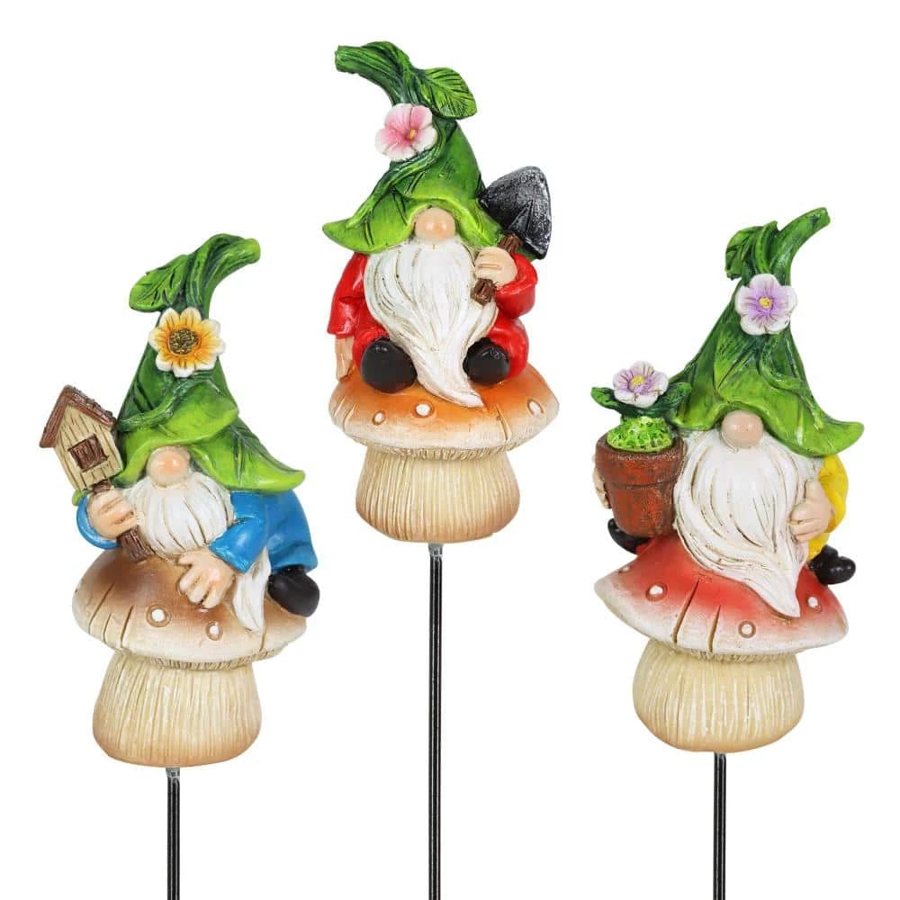 Exhart Leaf Hat Gnomes Sitting on Mushrooms 0.75 ft. Multi-Color Resin Plant Stakes (3-Pack) 3 Exhart Leaf Hat Gnomes Sitting on Mushrooms 0.75 ft. Multi-Color Resin Plant Stakes (3-Pack)