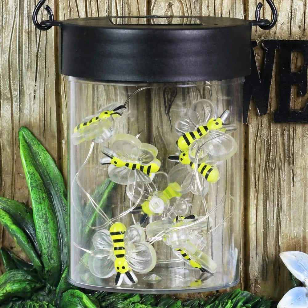 Exhart Solar Hand Painted Raccoon with a Lantern Jar of LED Fireflies by a Welcome Fence, 9 in. x 10.5 in. Garden Statue 7 Exhart Solar Hand Painted Raccoon with a Lantern Jar of LED Fireflies by a Welcome Fence, 9 in. x 10.5 in. Garden Statue - Image 5