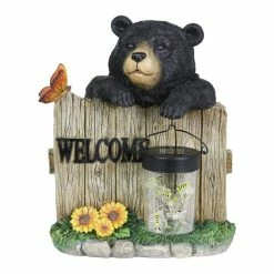 Exhart Solar Hand Painted Bear with a Lantern Jar of LED Fireflies by a Welcome Fence, 9.5 in. x 11 in. Garden Statue